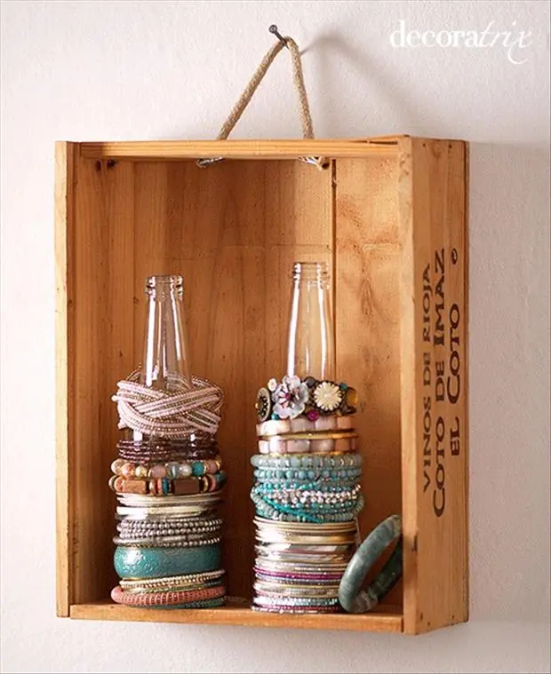bracelets and pony tails on glass bottle